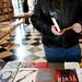 Plymouth resident Noah Posthuma reads the inside cover of a book at Literati Bookstore on Monday, April 1. Posthuma heard about the business from a friend. Daniel Brenner I AnnArbor.com